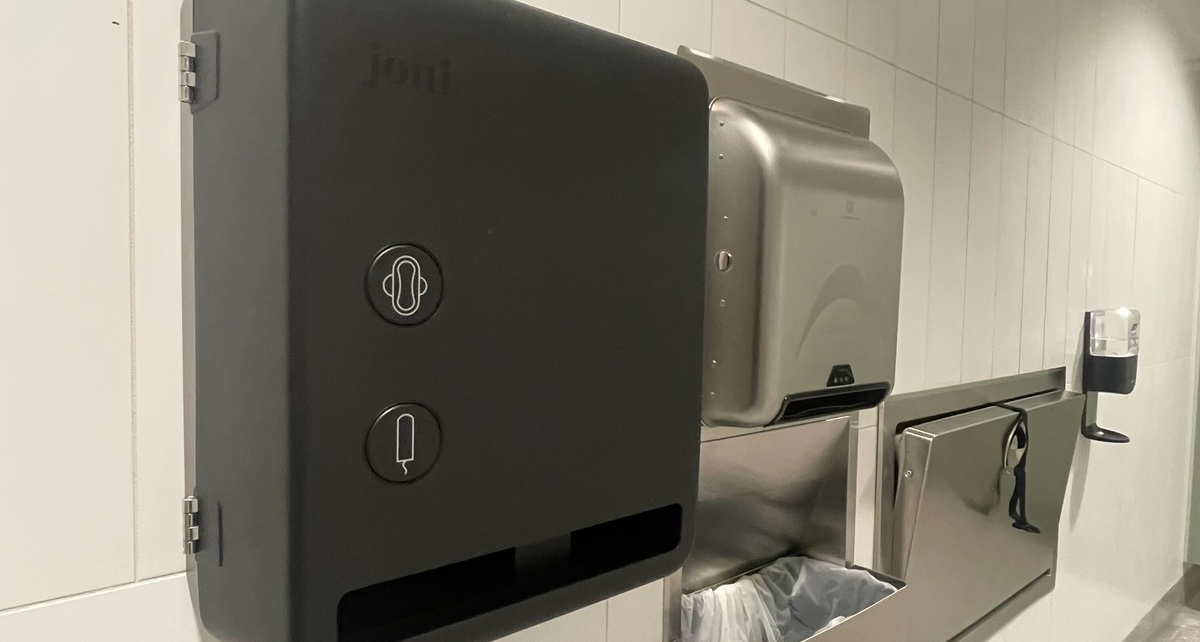 Period care dispenser at a federally regulated airport washroom