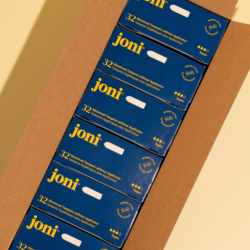 Boxes of joni tampons packed in a bulk shipping carton