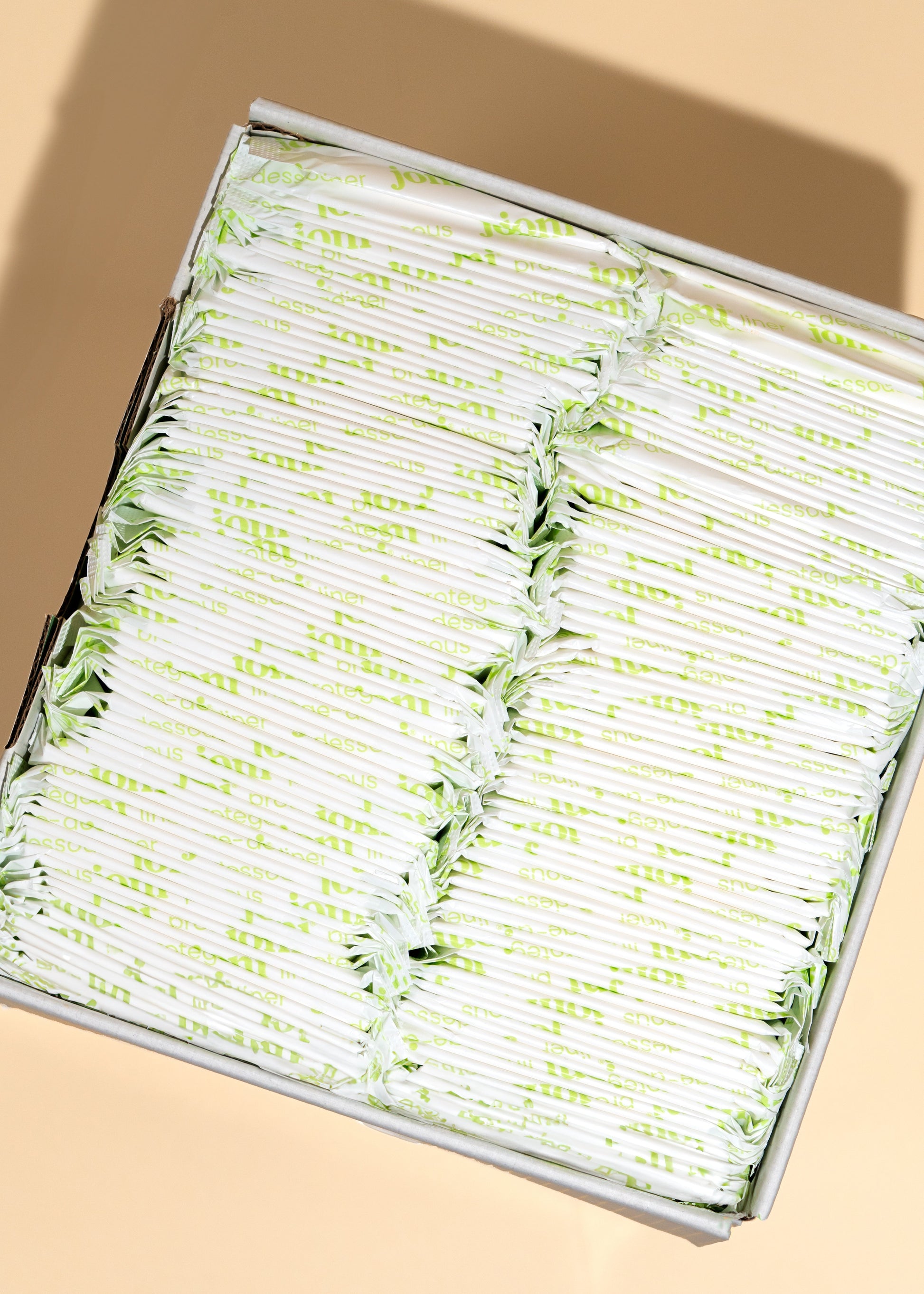 Open tray of individually wrapped joni bamboo pads