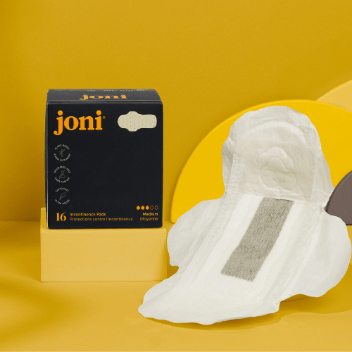 Organic Bamboo Incontinence Pads by joni, featuring ultra-thin and leak-proof design, displayed against a vibrant yellow background.