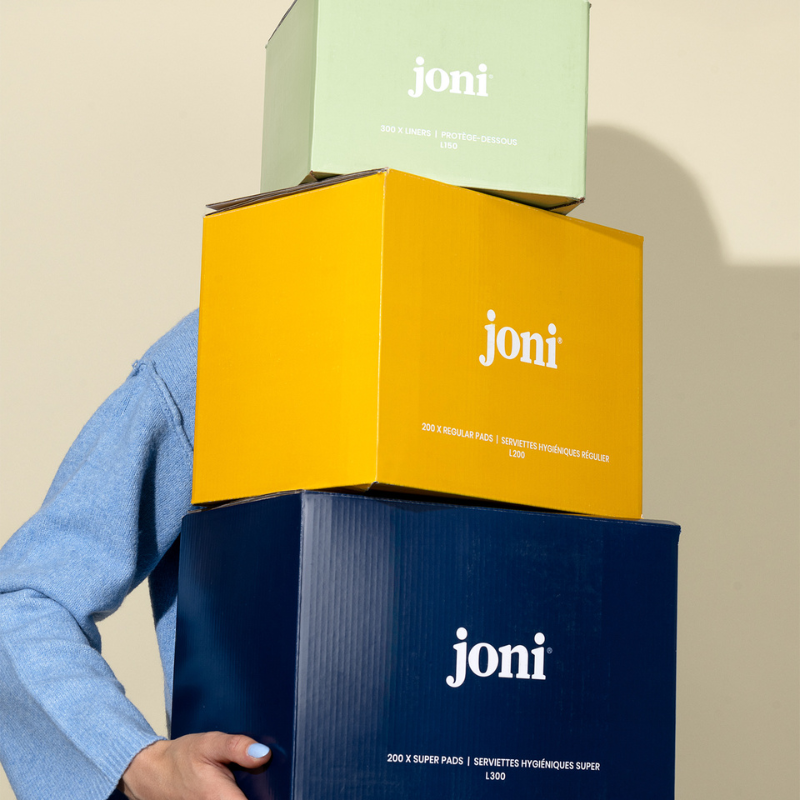 Three 'joni' boxes stacked on a beige background